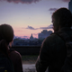 Joel and Ellie look toward Boston's capitol building in a moment from the game The Last of Us.